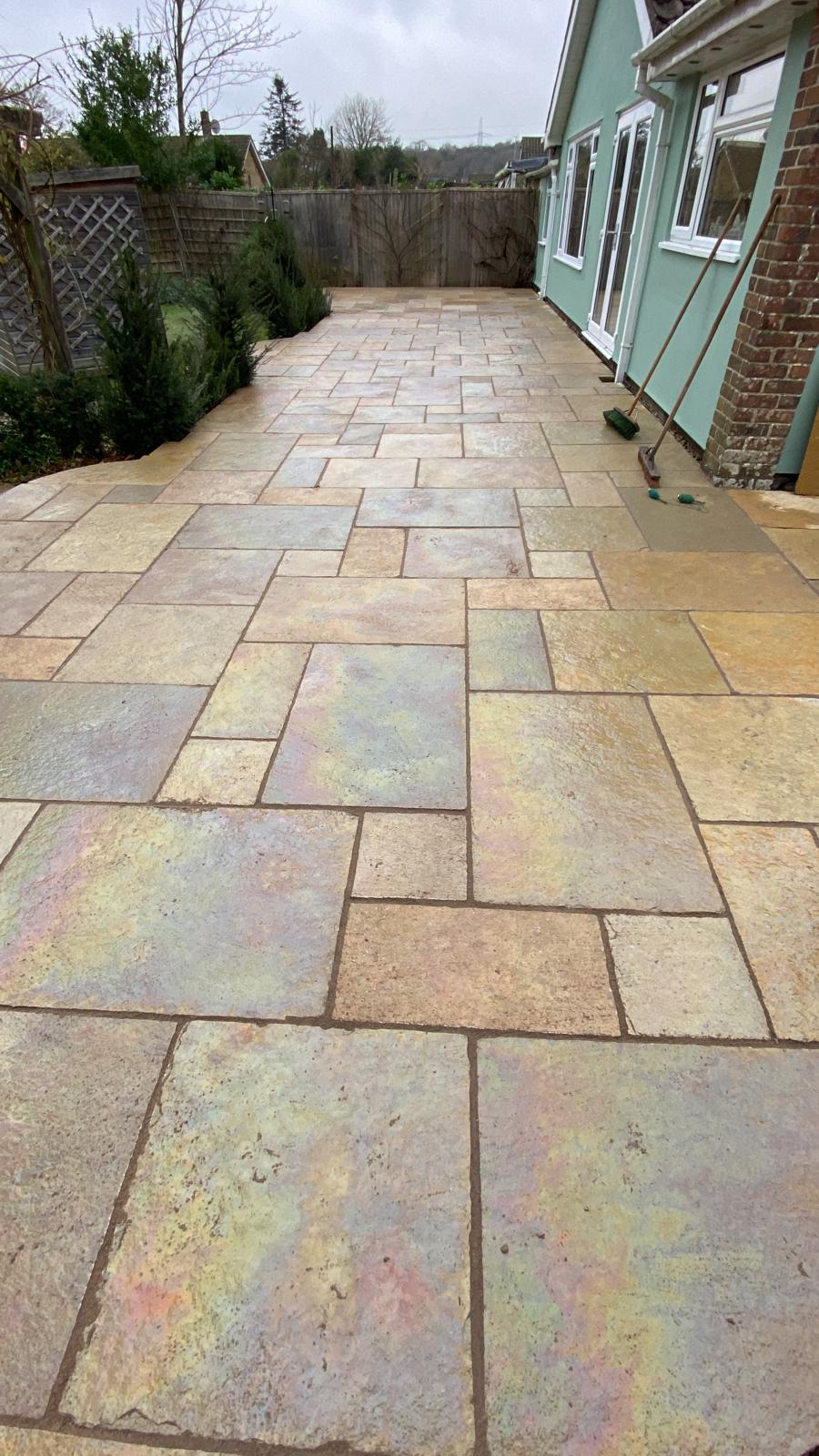 Customers finished garden patio are that wraps teh side and back of the property Customers finished garden patio are that wraps teh side and back of the property